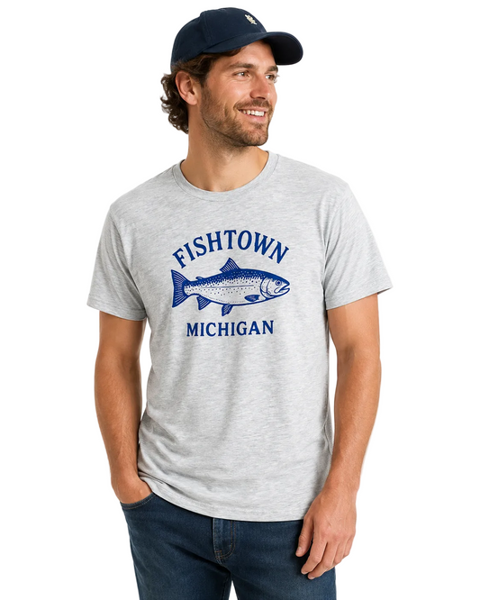 Man wearing a gray t-shirt with 'Fishtown Michigan' design on a white background